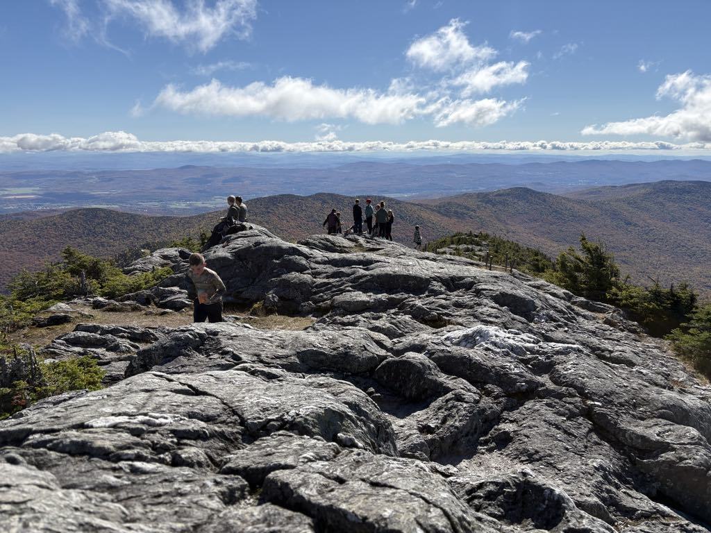 students gathered at the peak of Jay 
