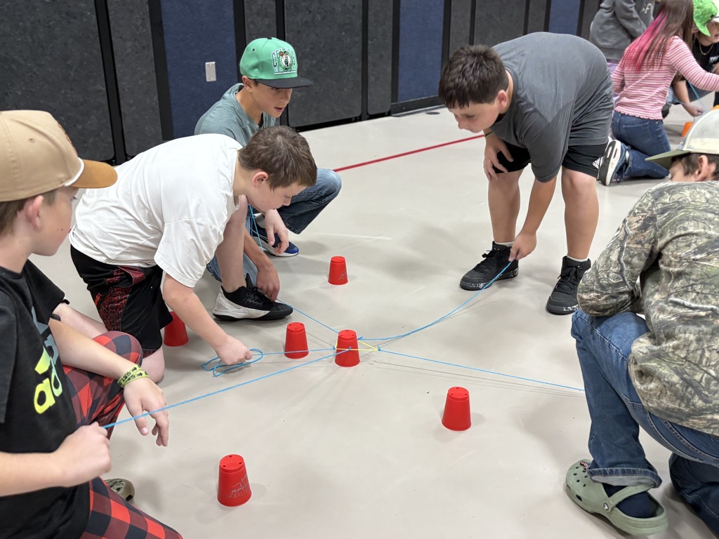 7th grade students working on the cup challenge together