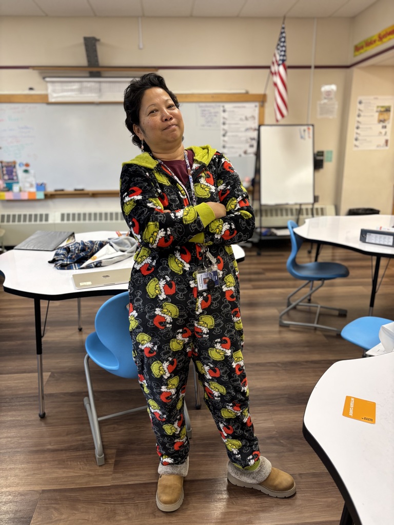 Ms. Phun in her grinch onsie for halloween
