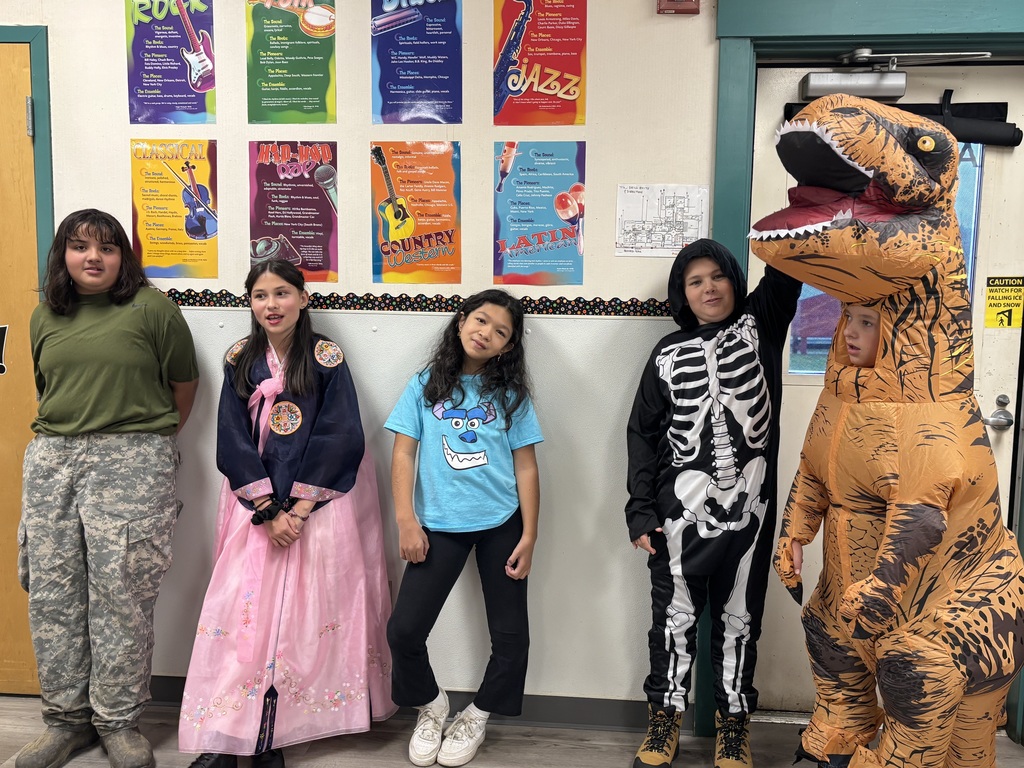 6th grade students in various halloween costumes