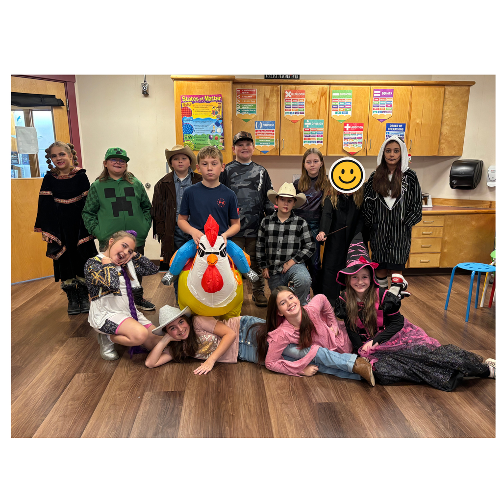 5th Grade Students posing in their halloween costumes