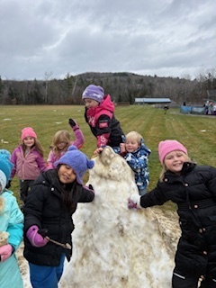 kids with giant snowball