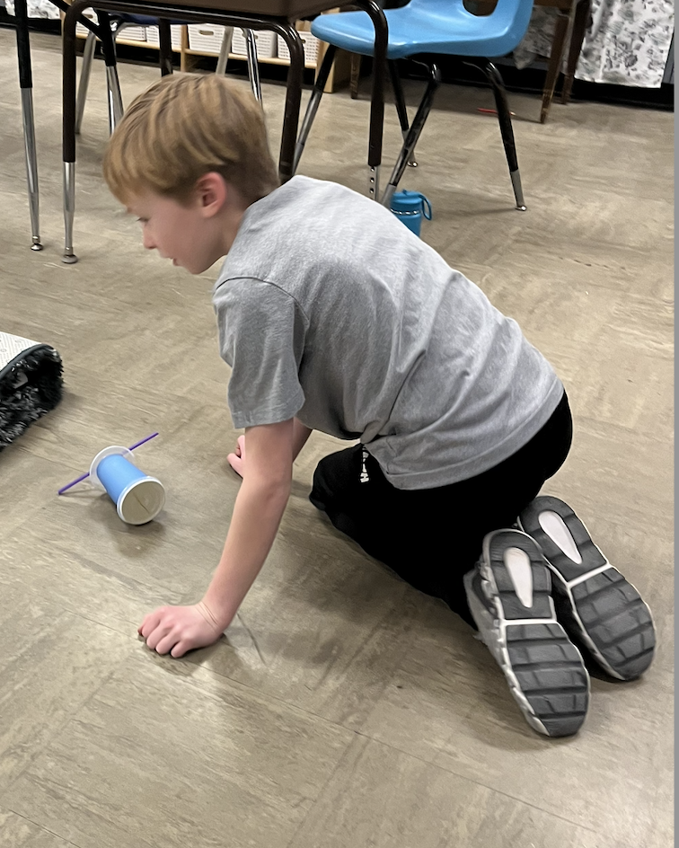 students in science preparing their 'cars'