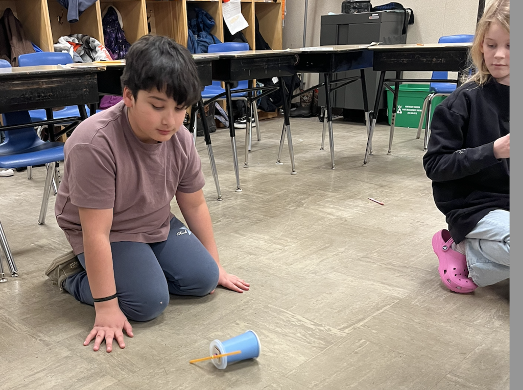 students in science preparing their 'cars'