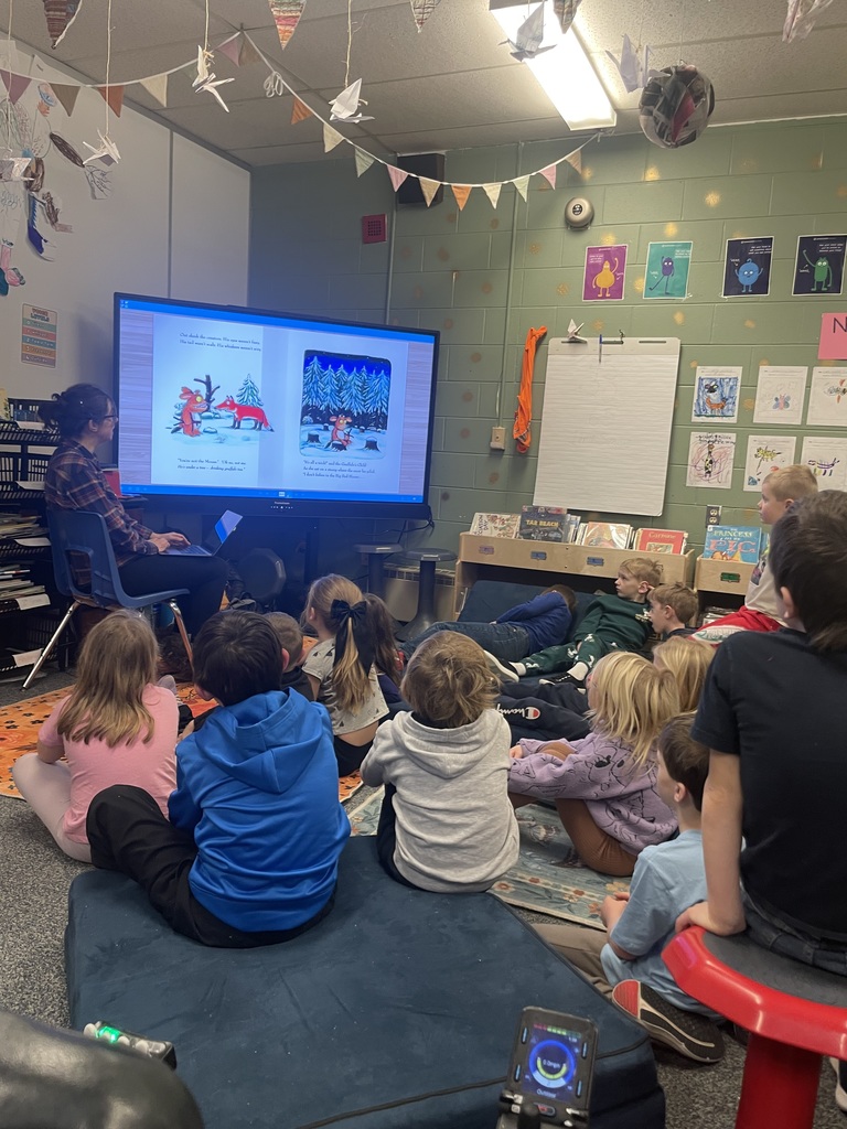 students listening to read aloud in Library 