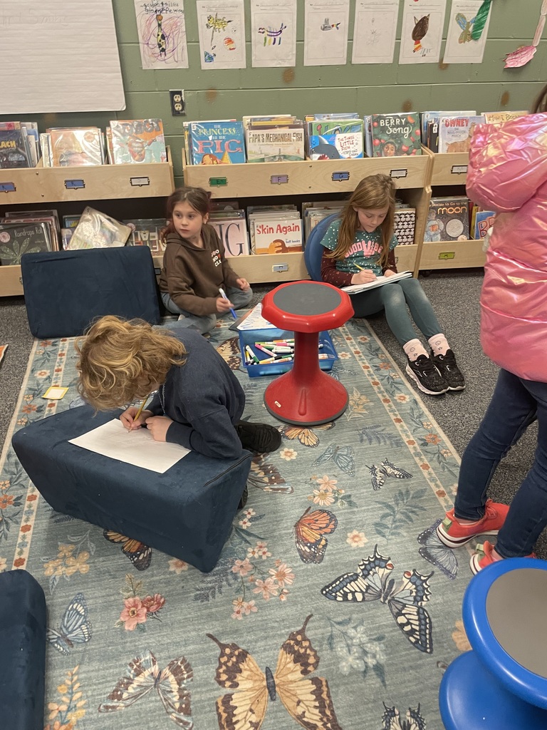 students coloring creatures in Library