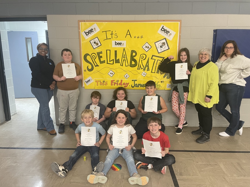 top 10 spellers (top 8 pictured) with Mrs Harryman (Director of Curriculum and Instruction), Mrs Jen Simpson (one of our judges for the spelling bee), and Ms Bousquet (organizer of the IVS spelling bee) 