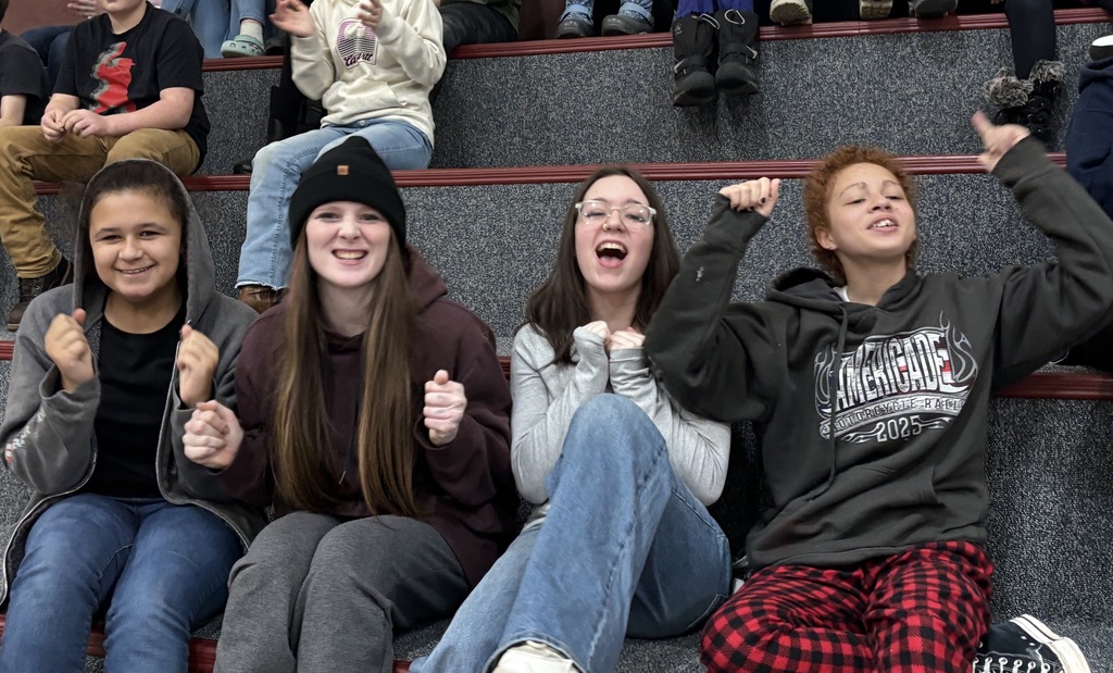 8th grade girls cheering their friend on! 