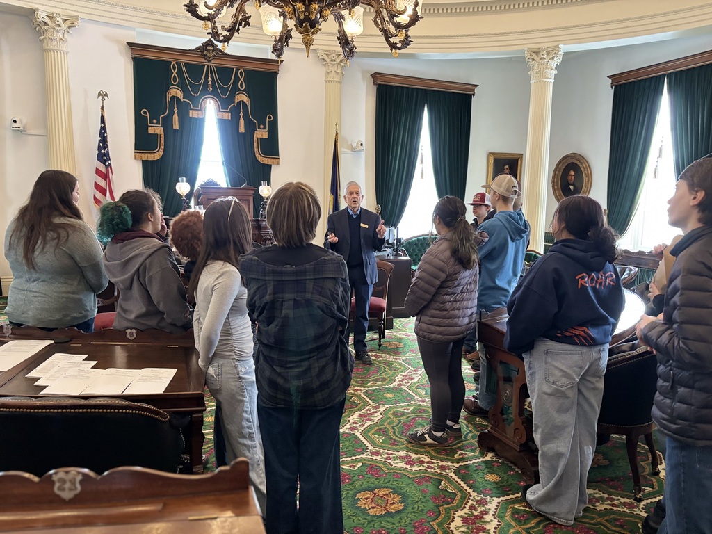 8th Grade students in the House of Representatives talking with their tour guide 
