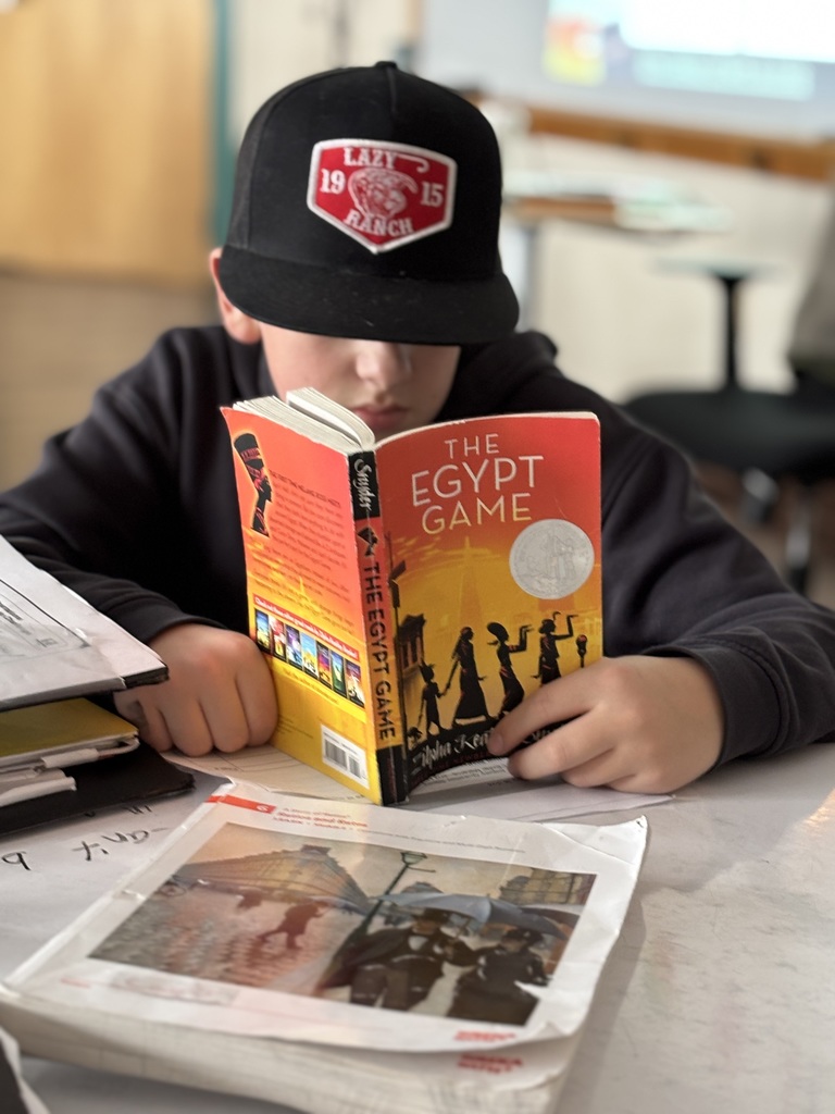 6th grade boy reading the Egypt Game 