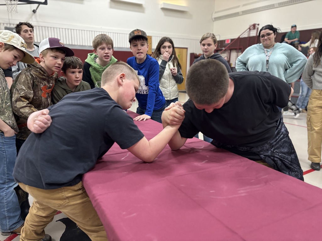 A 5th grader and 6th grade compete while being cheered on 