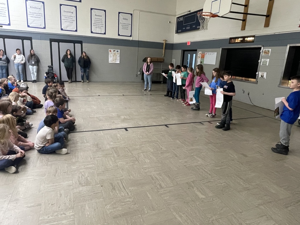 students performing in showcase with audience watching 