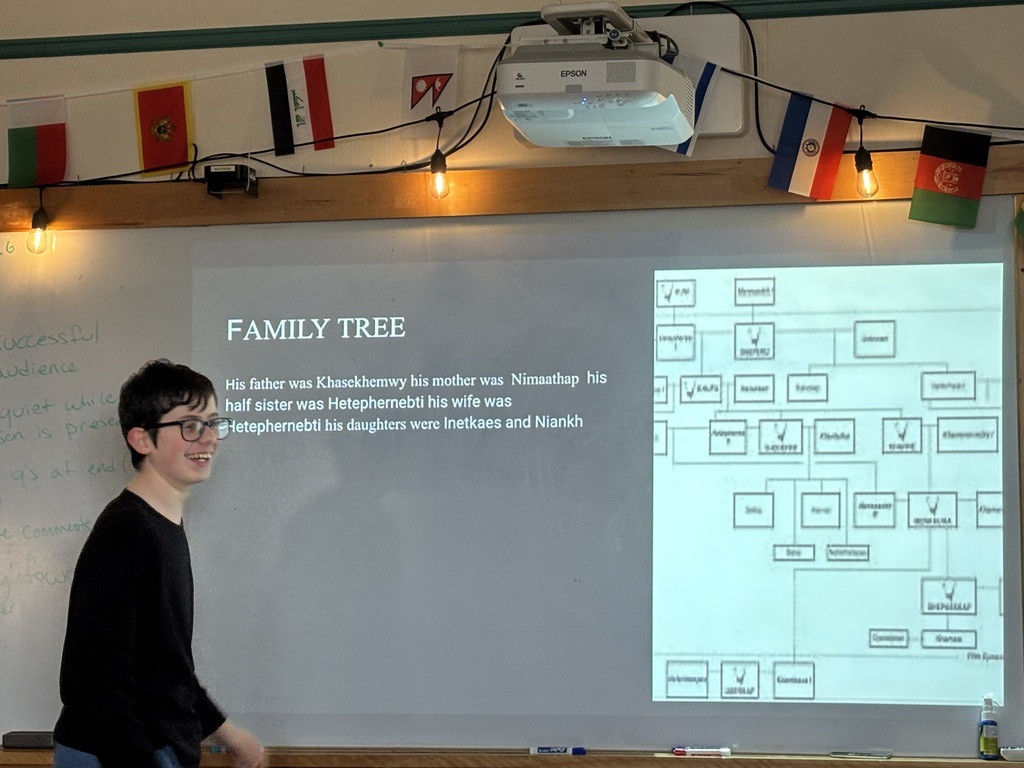 A 6th grade boy presents his project on an Egyptian Pharaoh in Social Studies 