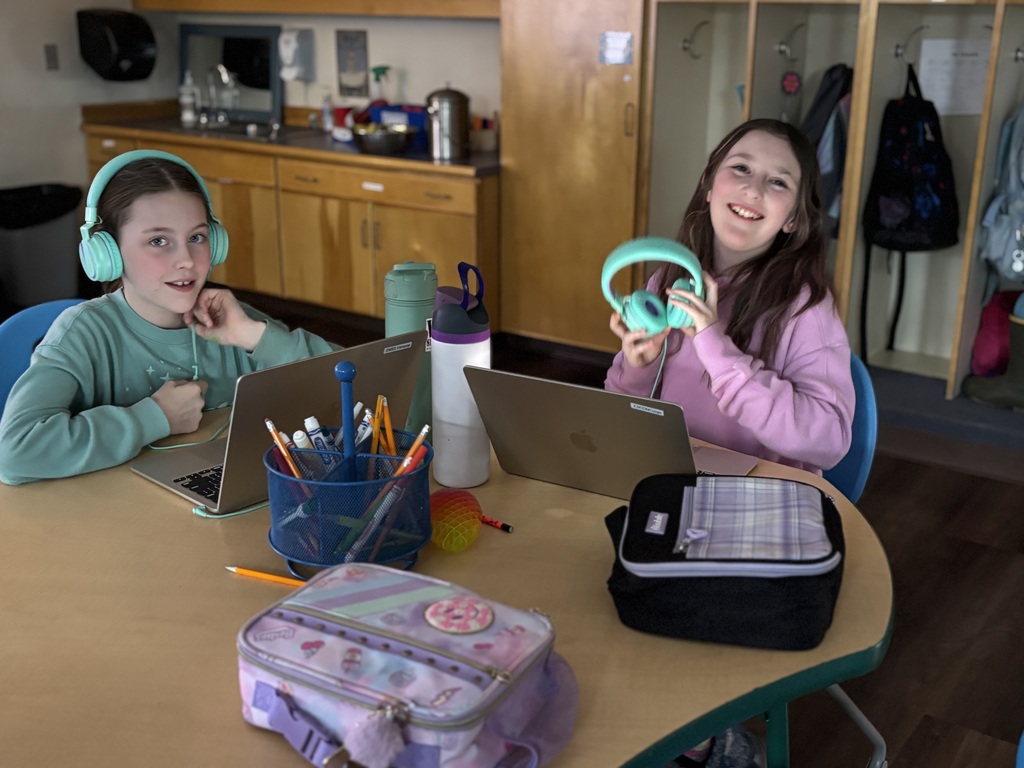two 5th grade girls work on ELA homework 