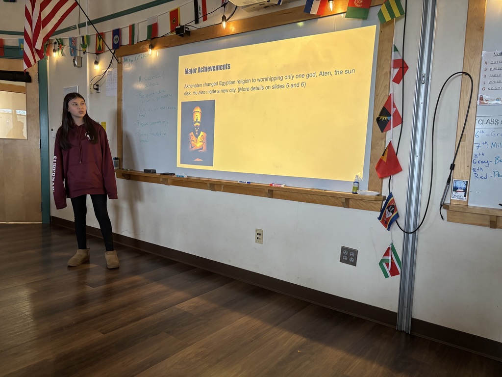 A 6th grade girl presents his project on an Egyptian Pharaoh in Social Studies 