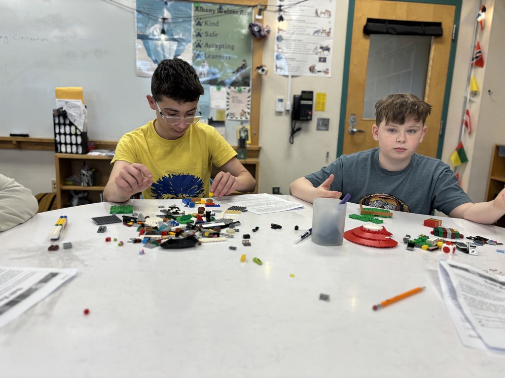 Two 7th grade boys work on recreating the Harrapan Civilization out of legos in Social Studies 