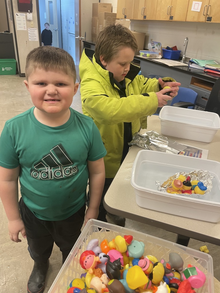 students at the building boats station