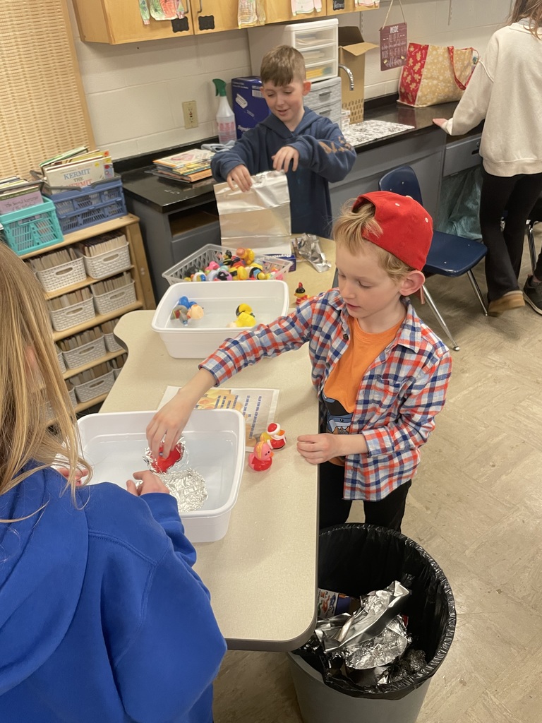 students at boat building station 