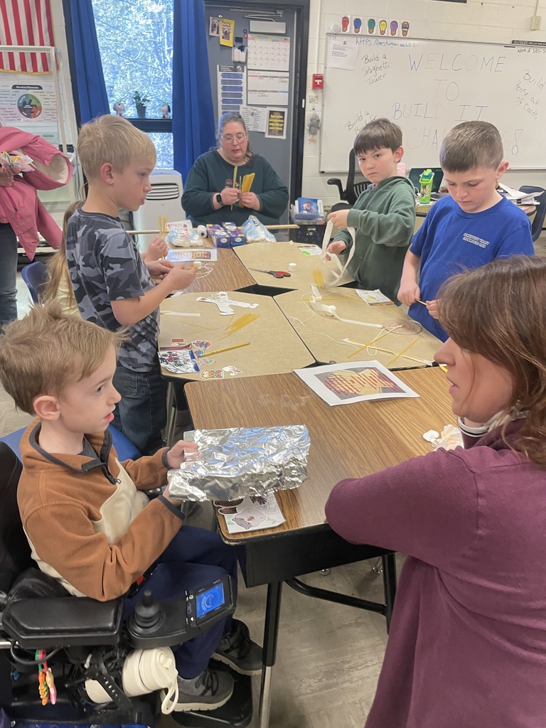 students and families at spaghetti tower building station 