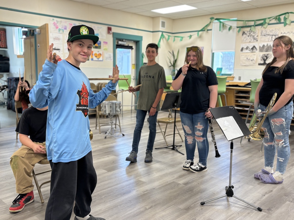 a mixture of 7th and 6th grade students working in band