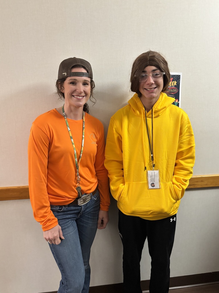 Ms. Angelee posing with a 7th grade boy who dressed as her