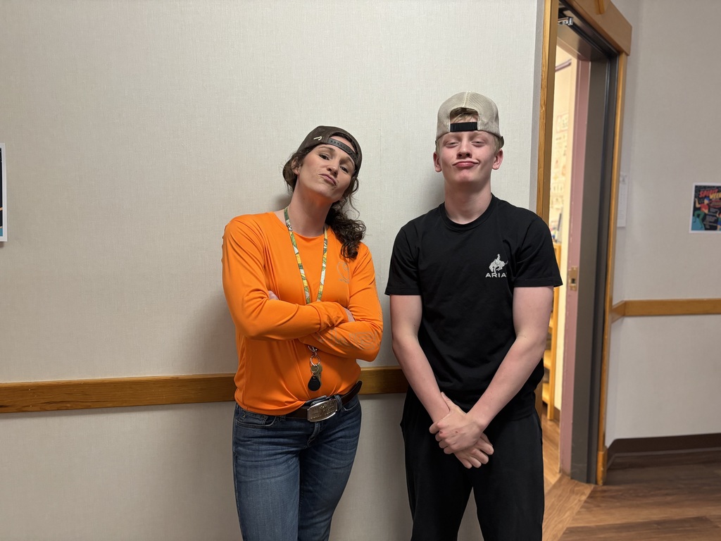 Ms. Angelee and an 8th grade boy posing, as Ms. Angelee dressed like him