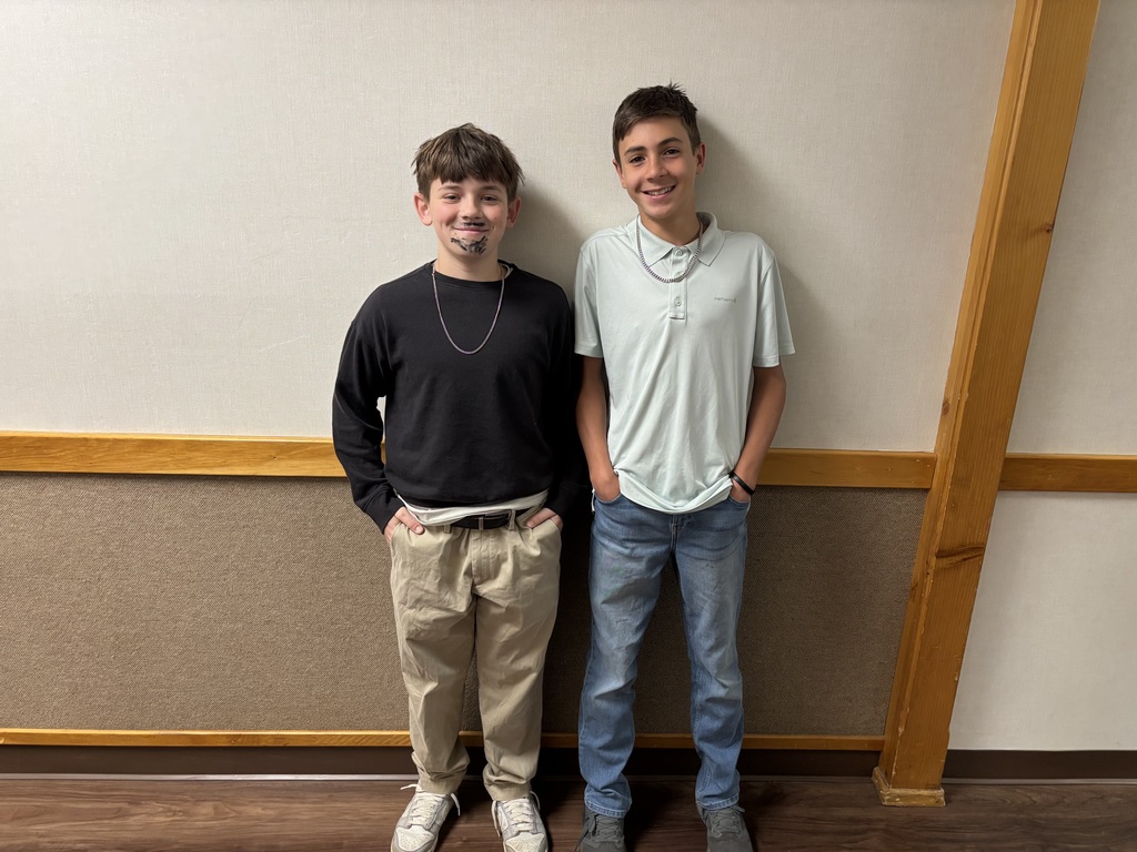 two 7th grade boys who dressed as Mr. Verge, our P.E. teacher