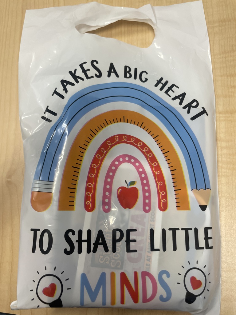 Treat Bag that reads "It takes a big heart to shape little minds" 