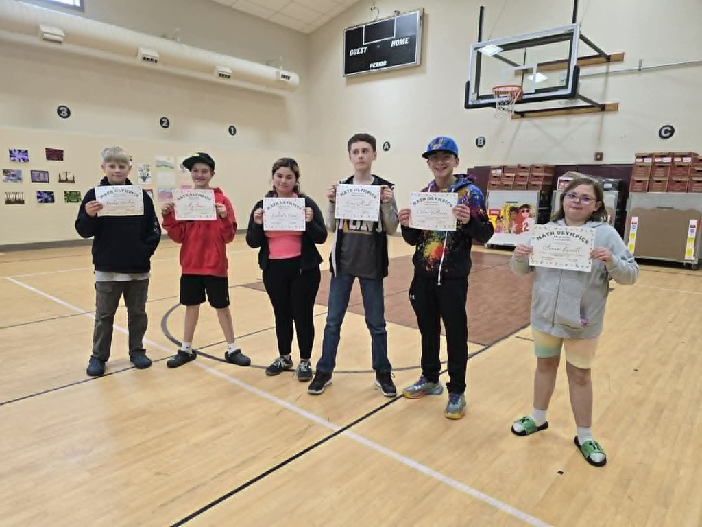 Albany students holding their certificates for winning second place at the Math Olympiads