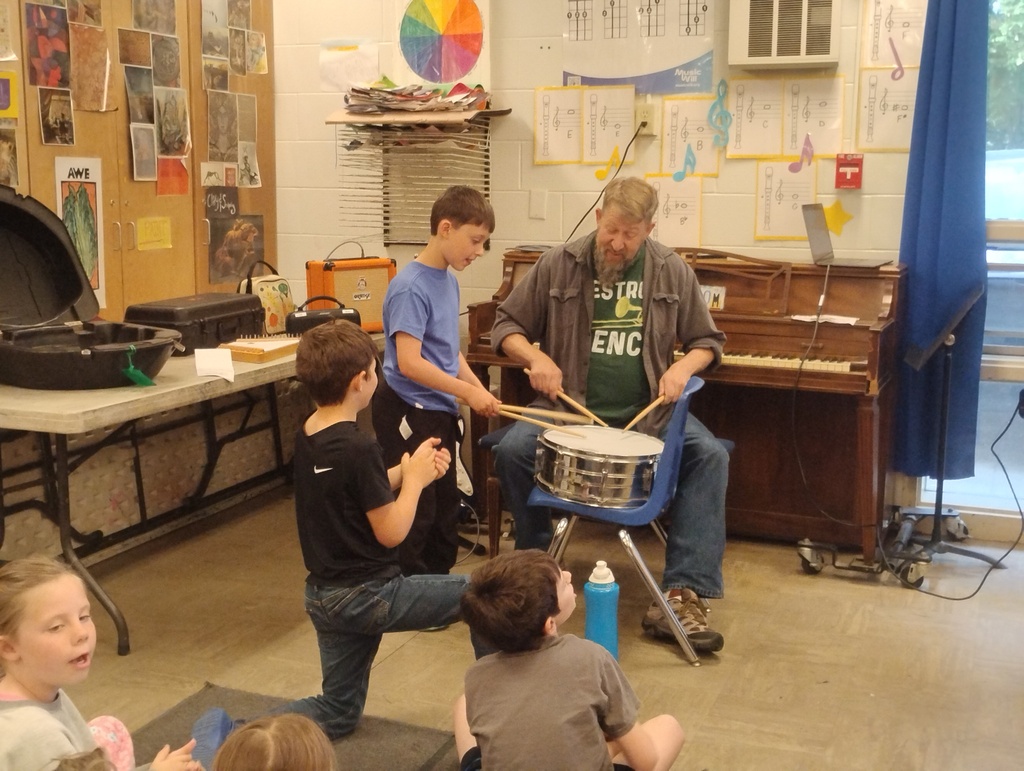students playing drums in music