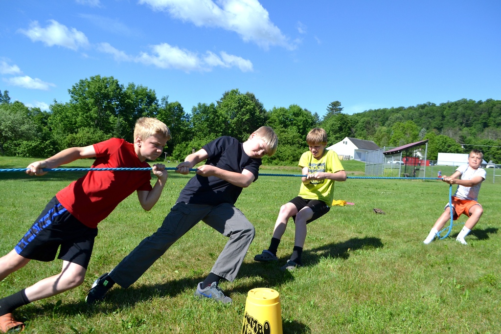 5th grade and 6th grade boys play tug o war 