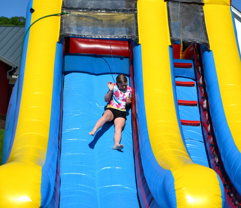 a 5th grade girl goes down the water slide on field day!