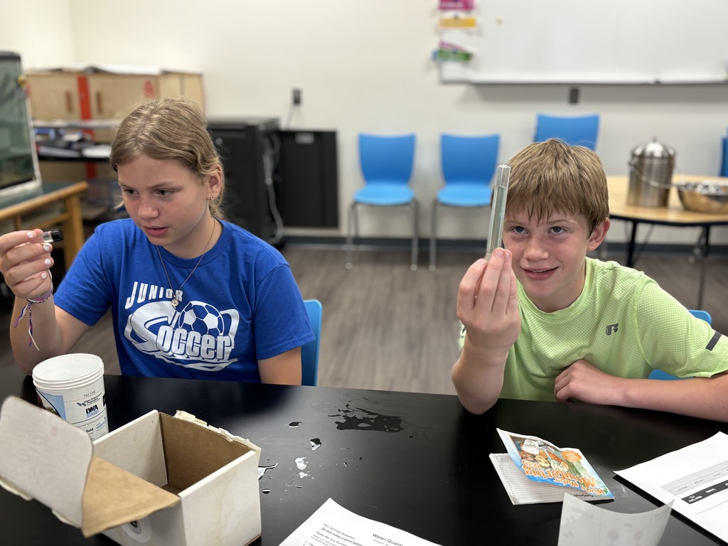 two rising 6th graders doing a water experiment in science for step-up day