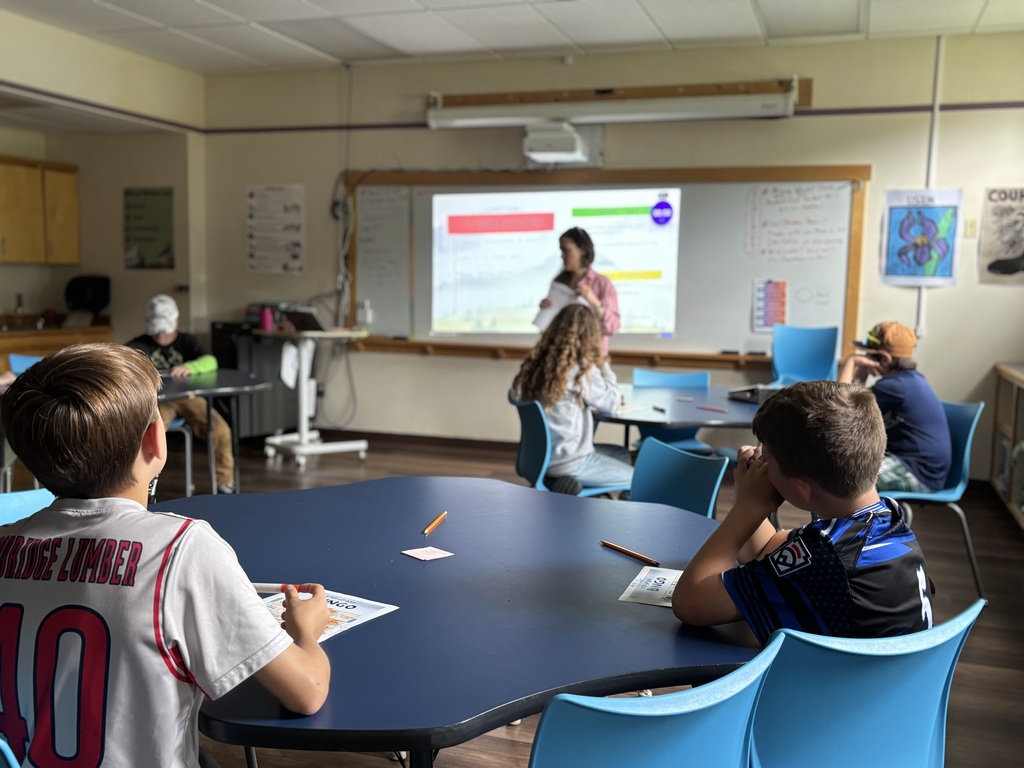 Ms. Nicolette running a writing activity with rising 6th graders for step-up day!