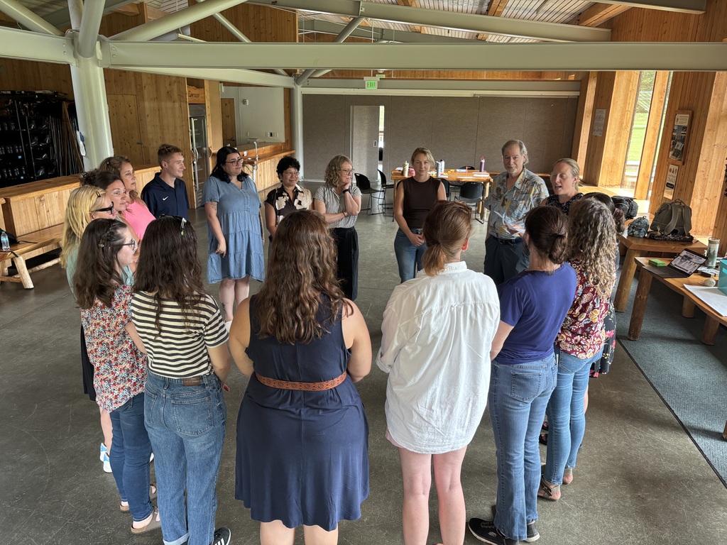 Staff standing in a circle 