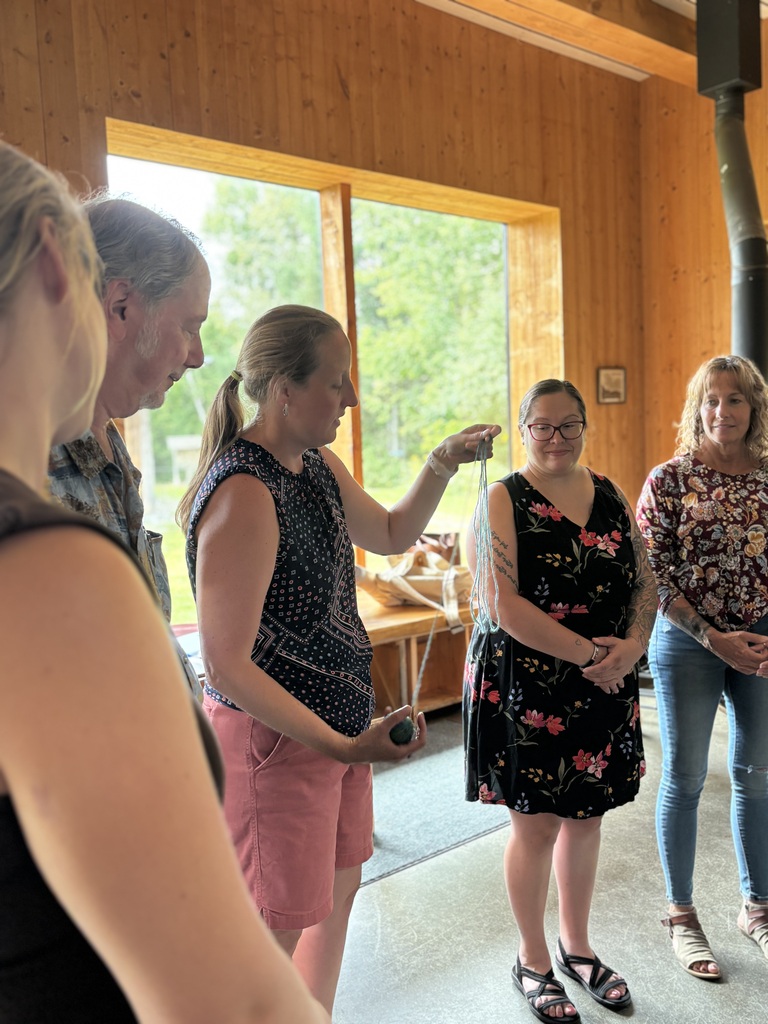 Jess explaining an activity with yarn