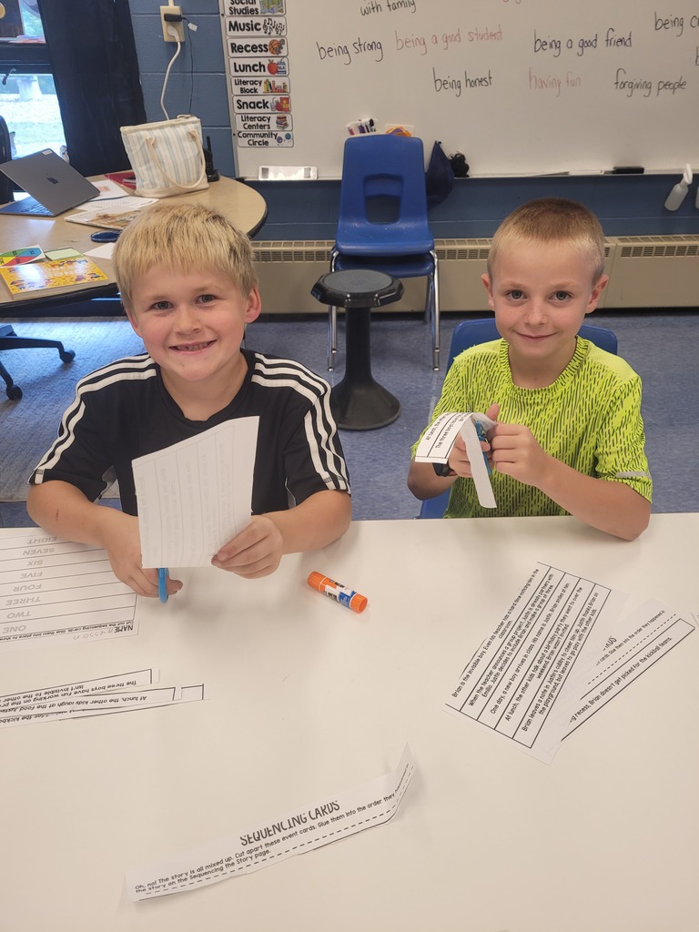 students smiling while doing their work