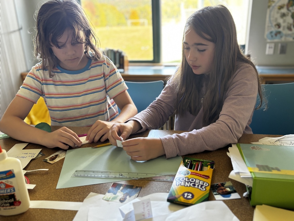 Two 6th grade girls working on an assignment in social studies 