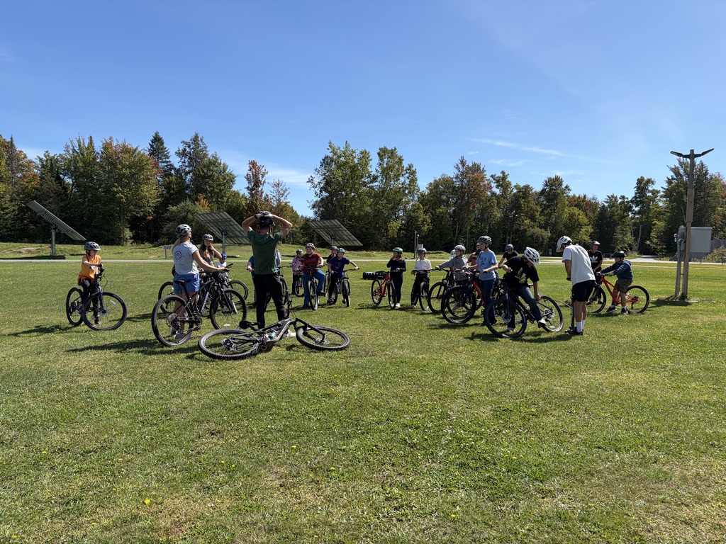 Students at the Craftsbury Outdoor Center in a semi-circle getting a bike talk