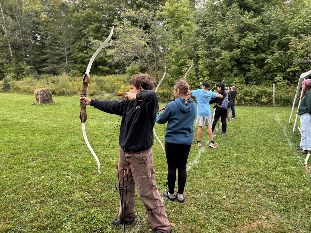 8th graders doing archery 