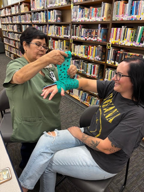 Staff practicing splinting arms