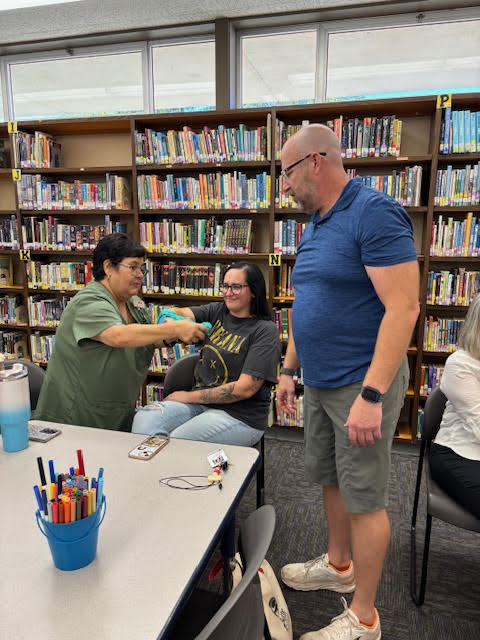 Staff practicing splinting arms
