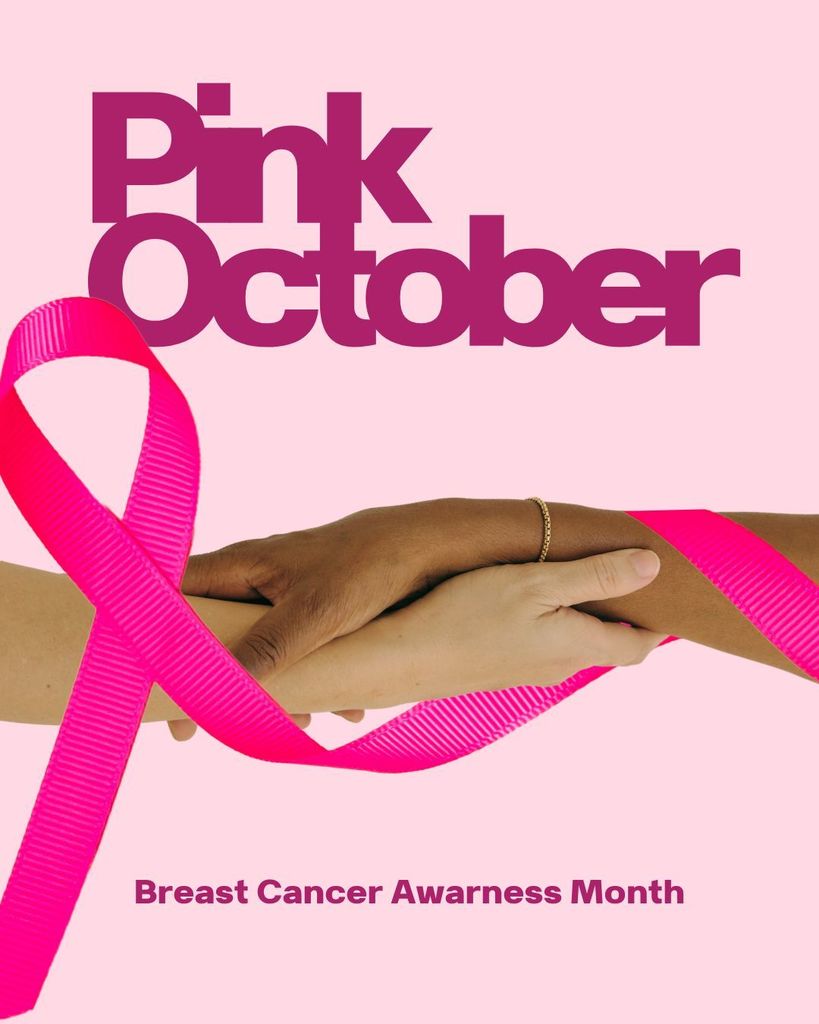 Pink October Two womens hands holding each other. Breast Cancer Awareness Month