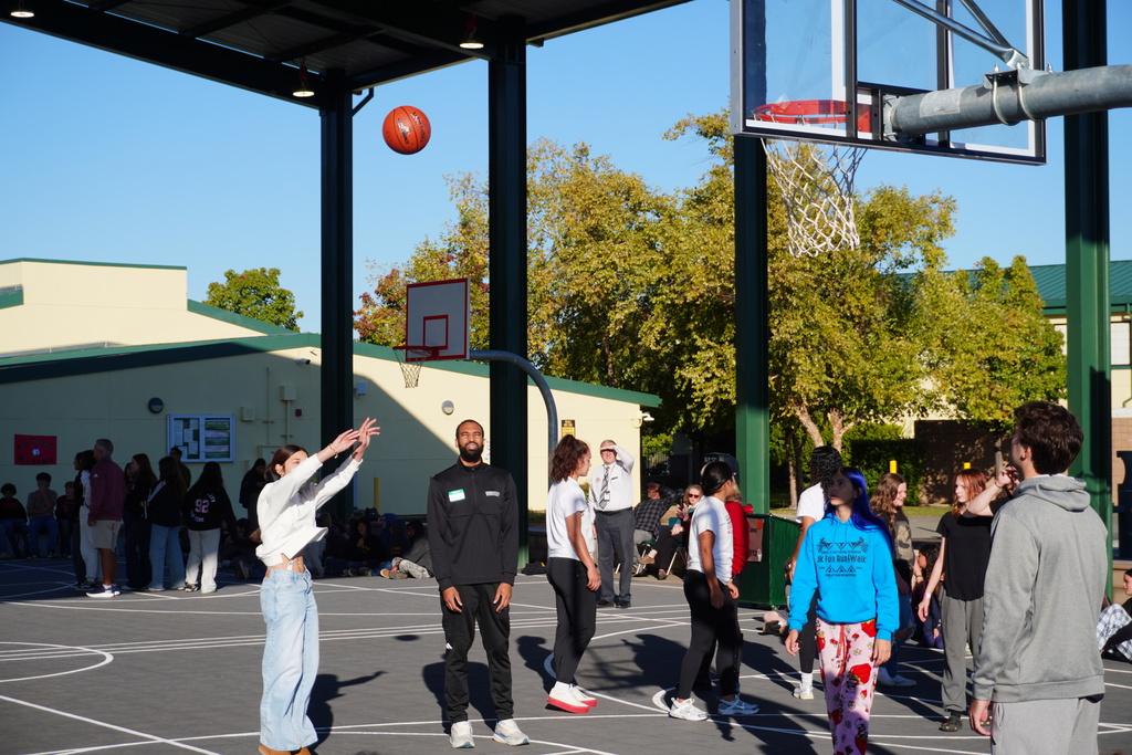 students shooting some baskets