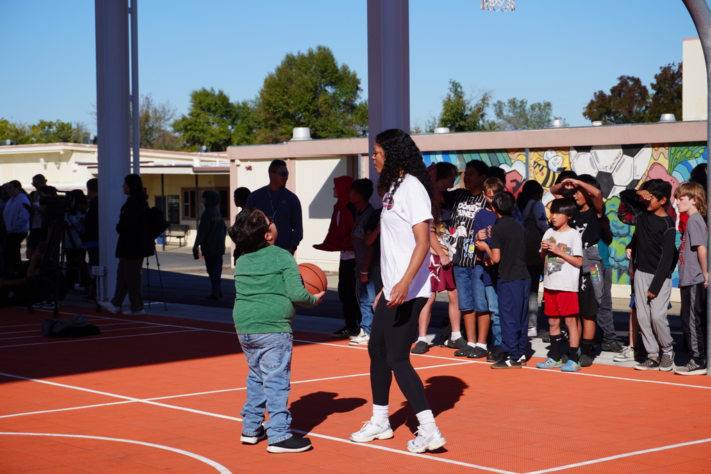 students shooting some baskets