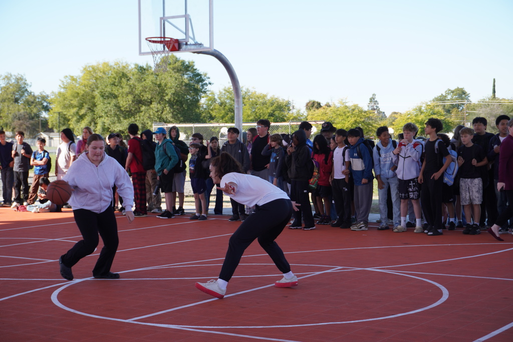 students shooting some baskets