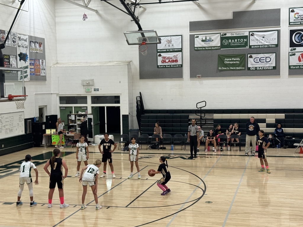 a player throwing a free throw in a gym