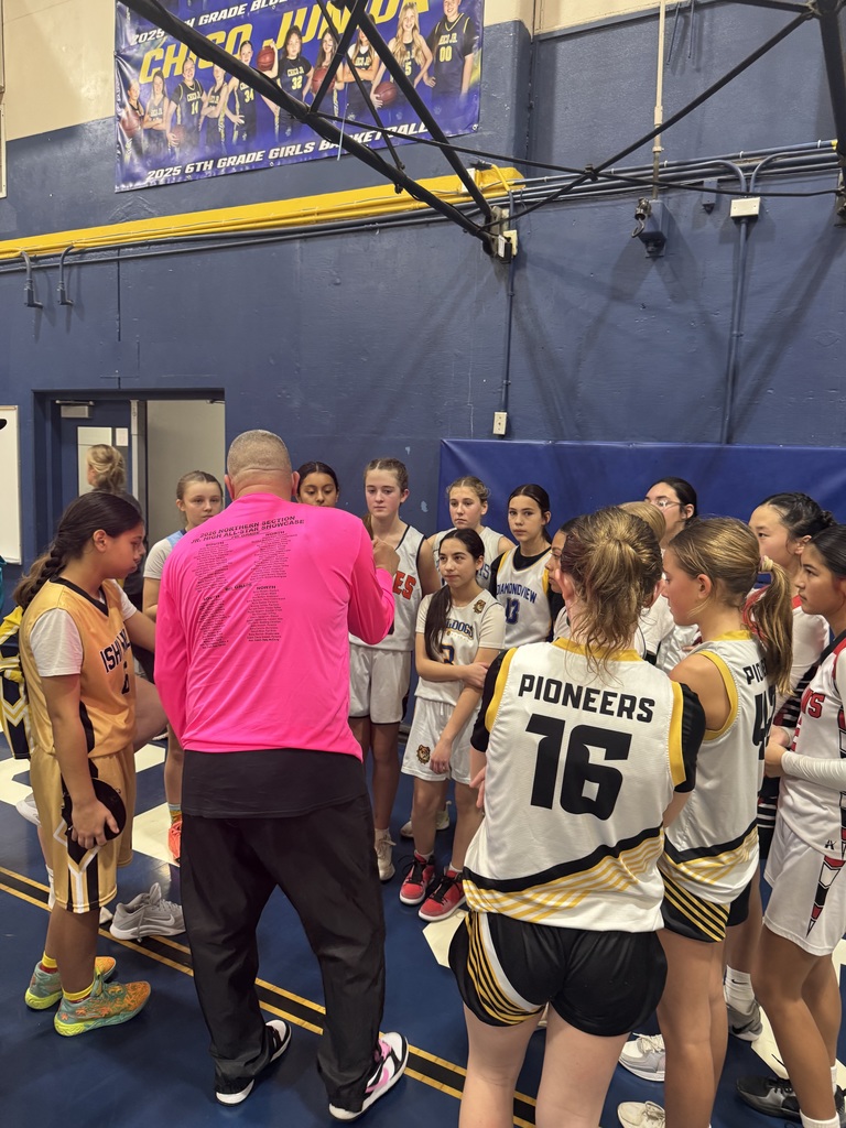 coach clint in a team huddle