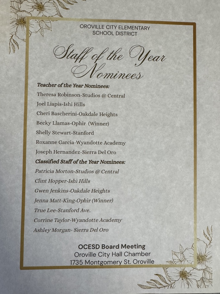 A close-up, top-down photograph shows a printed program document titled "Staff of the Year Nominees" for the Oroville City Elementary School District.  The document has a gold border with delicate line-art floral illustrations in the top-left and bottom-right corners. The text is printed in black ink on textured, off-white paper.Teacher of the Year Nominees:  Theresa Robinson - Studios @ Central  Joel Liapis - Ishi Hills  Cheri Bascherini - Oakdale Heights  Becky Llamas - Ophir (Winner)  Shelly Stewart - Stanford  Roxanne Garcia - Wyandotte Academy  Joseph Hernandez - Sierra Del Oro  Classified Staff of the Year Nominees:  Patricia Morton - Studios @ Central  Clint Hopper - Ishi Hills  Gwen Jenkins - Oakdale Heights  Jenna Matt-King - Ophir (Winner)  True Lee - Stanford Ave.  Corrine Taylor - Wyandotte Academy  Ashley Morgan - Sierra Del Oro