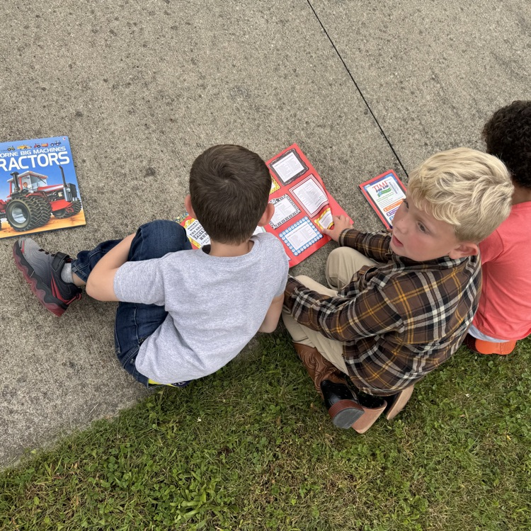Reading fun outside at OES! #everykid #redridernation